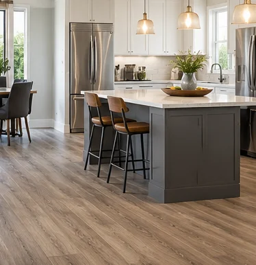 Luxury vinyl plank flooring in a white kitchen with an island